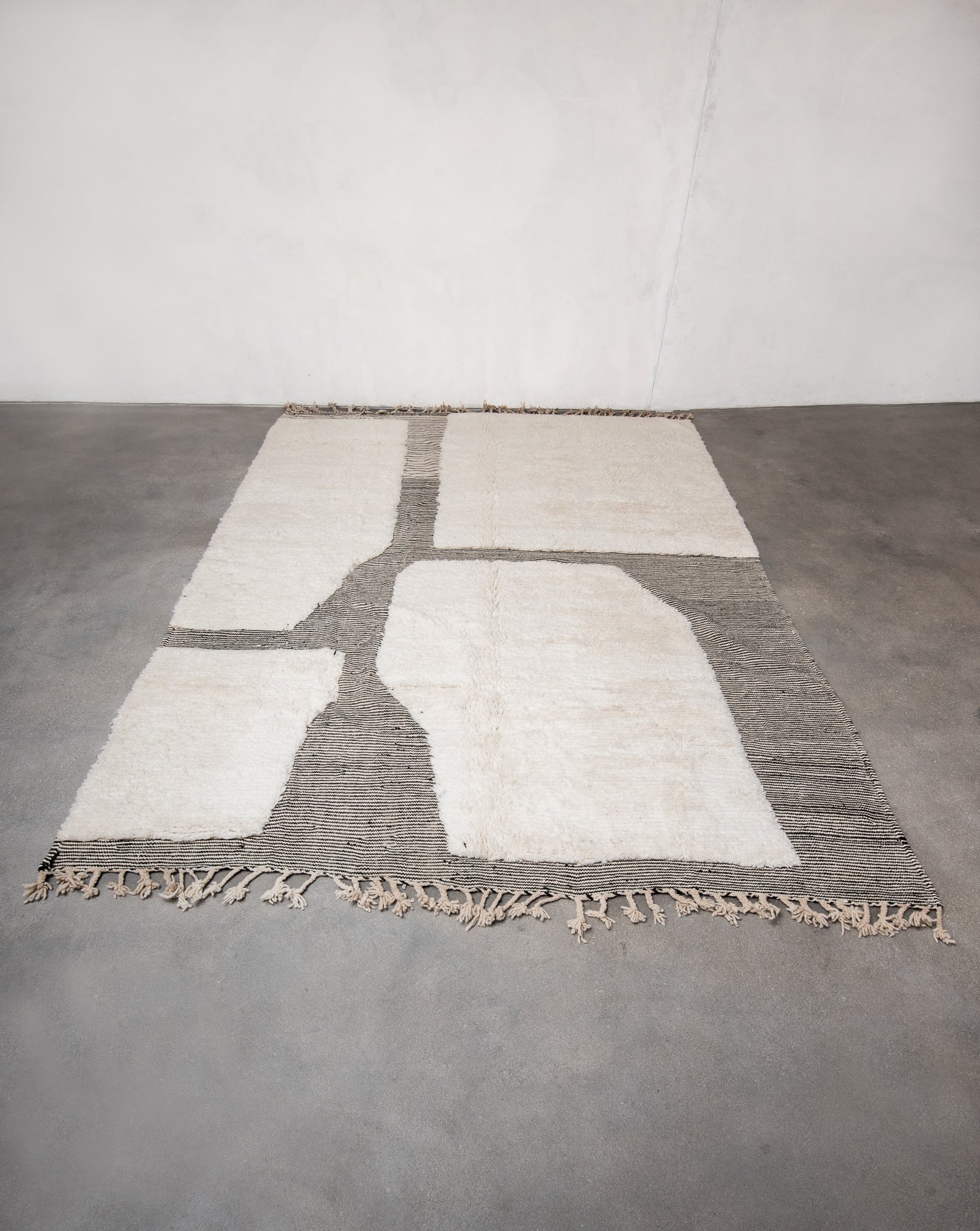 Modern, designer, handcrafted Berber rug from Morocco. Beniourain carpet with beautiful colours and patterns and fluffy wool texture.